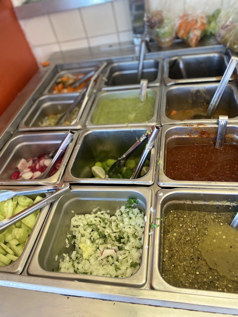 Clean restaurant seating near the counter area.